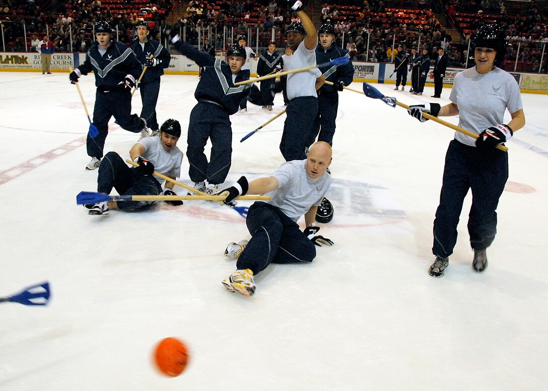 Medics and Maintainers find it hard to keep their footing Jan. 17 during a Broom Ball game during the first intermission of the Wichita Falls Wildcats game versus the Wenatchee Wild from Wenatchee, Wash. The Wildcats played host to personnel from Sheppard during its annual Military Appreciation Night. (U.S. Air Force photo/Mike Litteken)