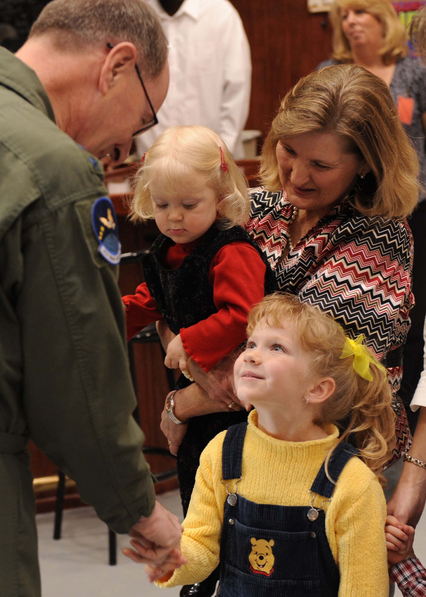 Gen. C. Robert Kehler, Air Force Space Command commander greets Michalah, Abigayil and Kathy Lundy, family members of Staff Sgt. Russ Lundy at Holloman Air Force Base, N.M., Jan. 14. General Kehler takes time to interact with family members of the 4th Space Control Squadron and to speak with the 49th Fighter Wing commander to renew his visibility of Holloman Air Force Base. (U.S. Air Force photo/SrA Michael Means)