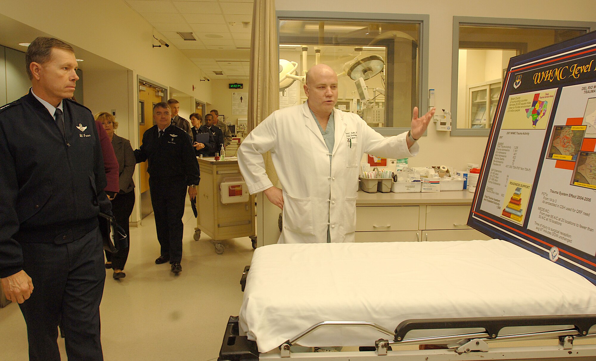 Col. (Dr.) David Smith, chairman, Department of Surgery (center), gives a trauma briefing to U.S. Air Force Vice Chief of Staff General William Fraser (left) in the Wilford Hall Medical Center Emergency Department Jan. 16. General Fraser stopped by Wilford Hall during his visit to Lackland Air Force Base and also received briefings on en-route care and the San Antonio Military Medical Center. (U.S. Air Force photo/Senior Airman Josie Kemp)