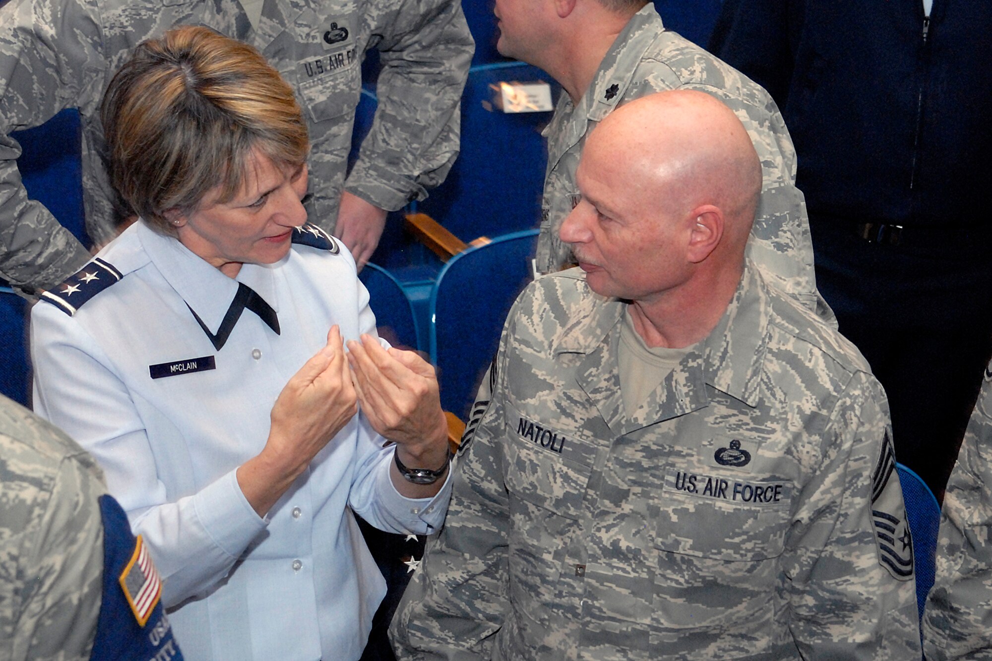 Maj. Gen. K.C. McClain, Air Force Personnel Center commander, speaks with Chief Master Sgt. David Natoli, 721st Mission Support Group superintendent, after the Spread the Word briefing at the at the Peterson AFB Auditorium  Jan. 13. (Air Force photo/Larry Hulst)