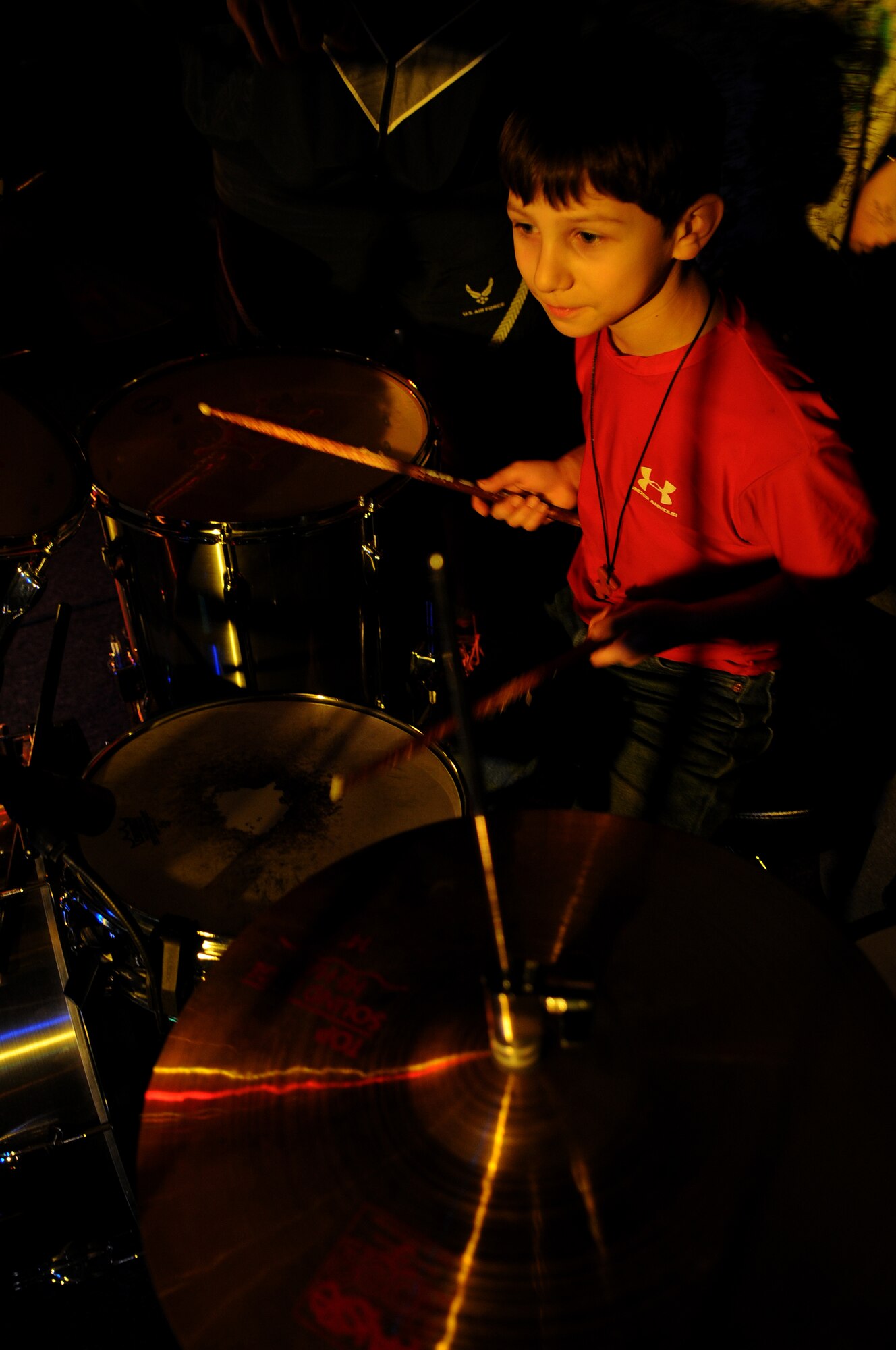 Benjamin DeCorte, son of Mark DeCorte, 86th Aeromedial Evacuation Squadron first sergeant, plays the drums prior to the start of the Battle of the Bands event Jan. 16, 2009, on Ramstein Air Base. The event was sponsored by Armed Forces Against Drunk Driving. (U.S. Air Force photo by Airman 1st Class Grovert Fuentes-Contreras)
