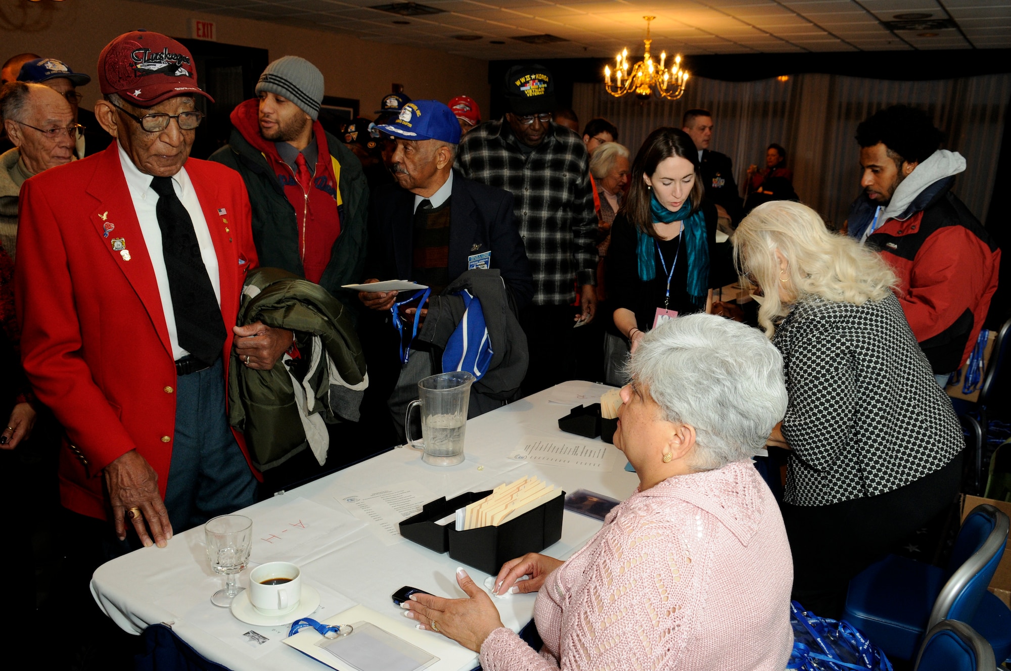 Tuskegee Airman and their families are processed through a security check-in line Jan. 20 on Bolling. More than 180 Tuskegee Airmen and their families gathered for a breakfast  and security clearing at the Bolling Club, before being bused downtown for the 2009 inaugural events. (U.S. Air Force photo by Staff Sgt. Dan DeCook)