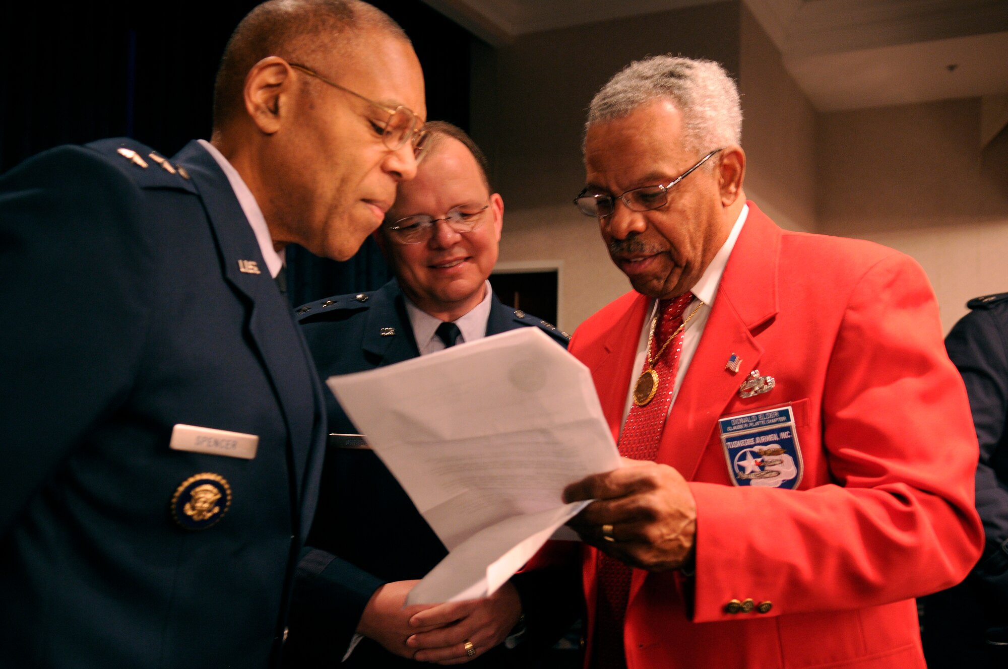 Brig. Gen. Larry Spencer, Director of Air Force Budget, and Brig. Gen. Bruce Green, Deputy Surgeon General, speak with Donald E. Elder, an original Tuskegee Airmen Jan. 20 on Bolling. More than 180 Tuskegee Airmen and their families gathered for a breakfast  and security clearing at the Bolling Club, before being bused downtown for the 2009 inaugural events. (U.S. Air Force photo by Staff Sgt. Dan DeCook)