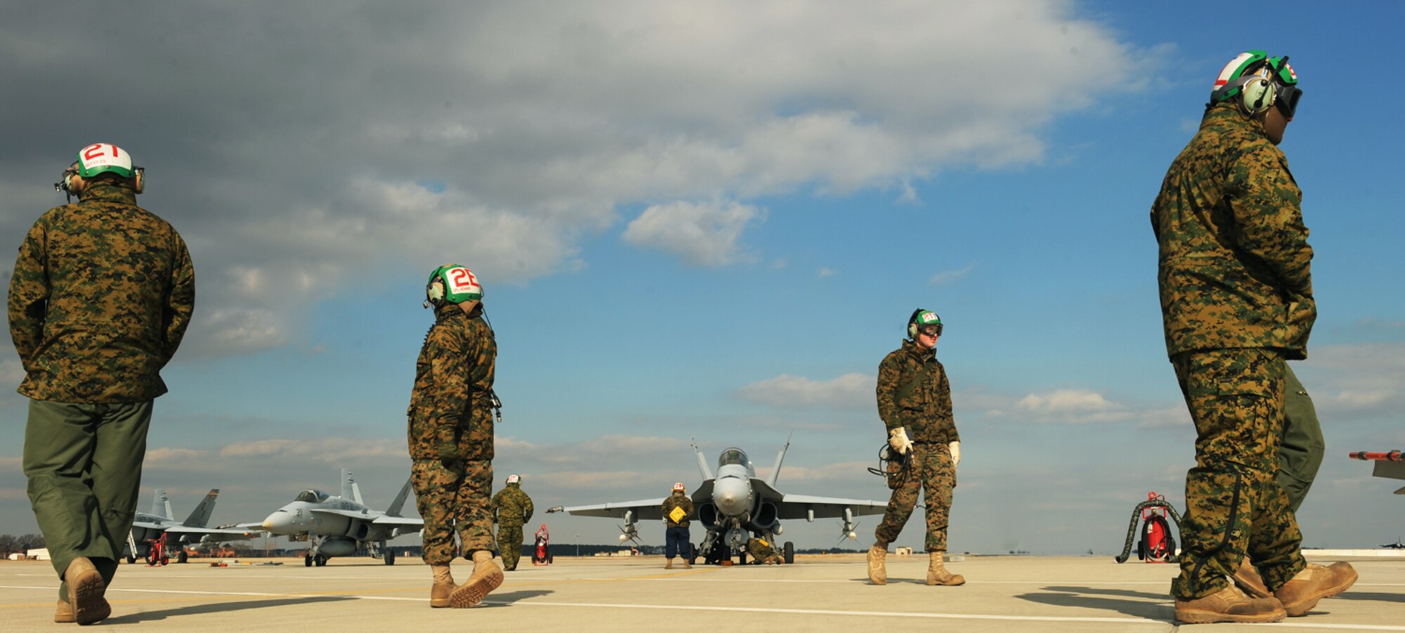LANGLEY AIR FORCE BASE, Va. --  F/A-18 Hornet aircraft maintainers from Marine Fighter Attack Squadron 312, occupy the flight line during combat certification training for pilots Jan. 13.  The 71st and 94th Fighter Squadrons conducted dissimilar aircraft training with the Marine crews in preparation for upcoming exercises. (U.S. Air Force photo/Senior Airman Vernon Young)