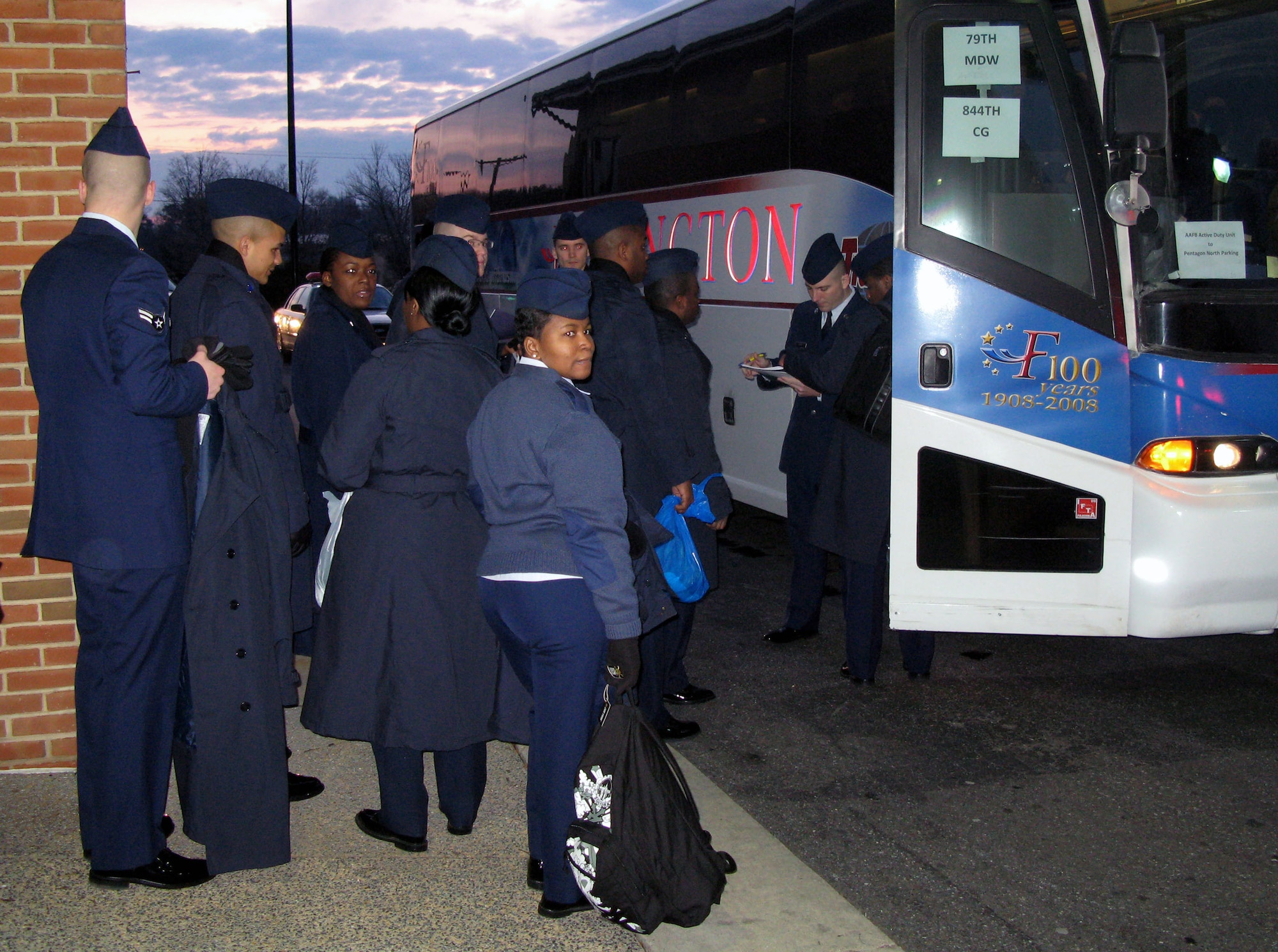 Airmen from Andrews Air Force Base, Md., board a bus en route to Washington, D.C., to march in the Jan. 20 inauguration day parade. (Defense Department photo/Donna Miles)
