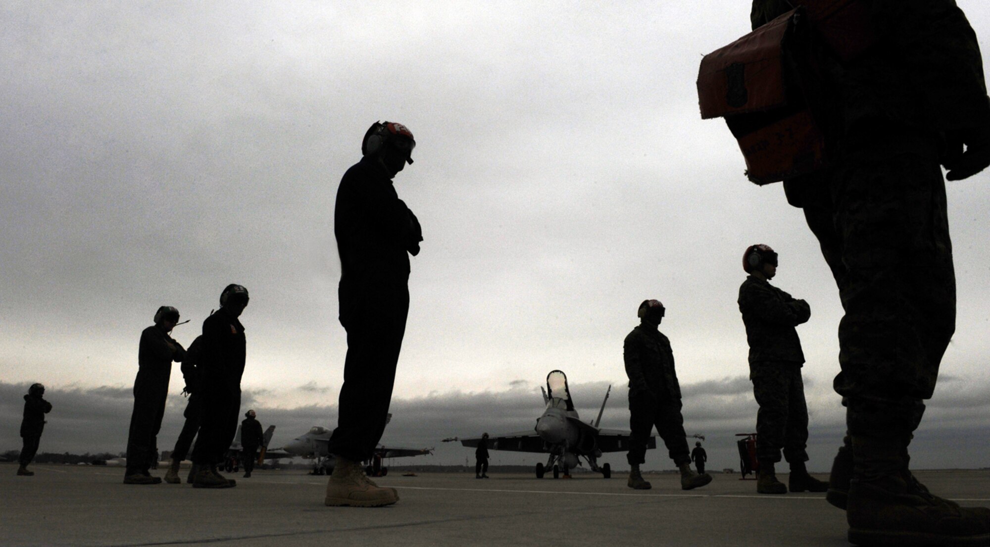 LANGLEY AIR FORCE BASE, Va. --  F/A-18 Hornet aircraft maintainers from Marine Fighter Attack Squadron 312, occupy the flightline during combat certification training for pilots Jan. 13.  The 71st and 94th Fighter Squadrons conducted dissimilar aircraft training with the Marine crews in preparation for upcoming exercises. (U.S. Air Force photo/Senior Airman Vernon Young)