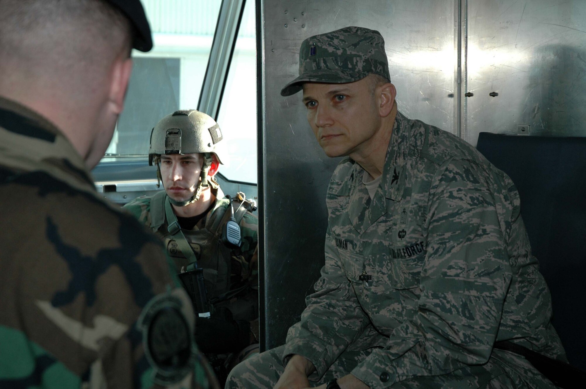 Chaplain (Col.) Brett Oxman listens as 341st Security Forces tactical response force members describe their mission while in transit to the close-quarters battle center Jan. 12. (U.S. Air Force photo/Senior Airman Dillon White)