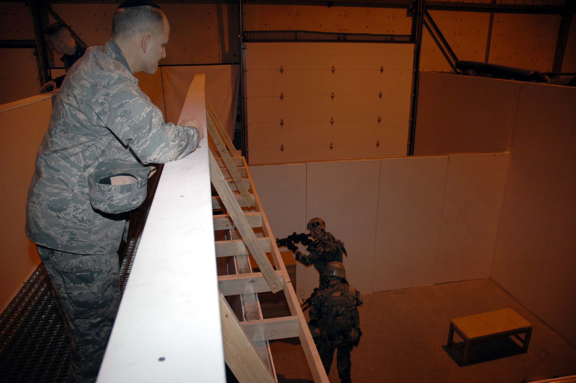 Chaplain (Col.) Brett Oxman, USSTRATCOM chaplain watches 341st Security Forces Group tactical response force members train at the close-quarters battle center Jan. 12 (U.S. Air Force photo/Senior Airman Dillon White) 