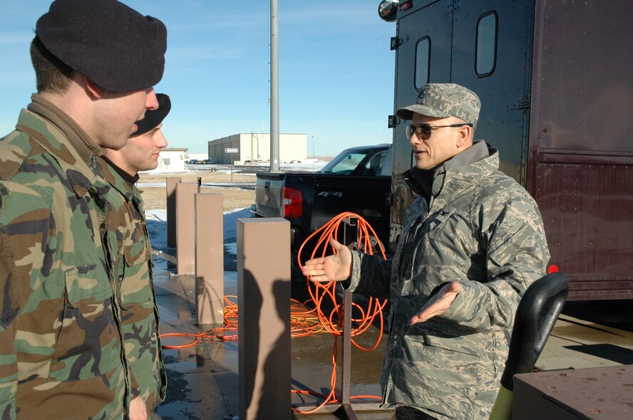 Chaplain (Col.) Brett Oxman, USSTRATCOM chaplain, speaks with 341st Security Forces Group tactical response force members upon his arrival to Building 250 for a TRF briefing, tour and demonstration at the TRF shoot house Jan. 12. (U.S. Air Force photo/Senior Airman Dillon White)