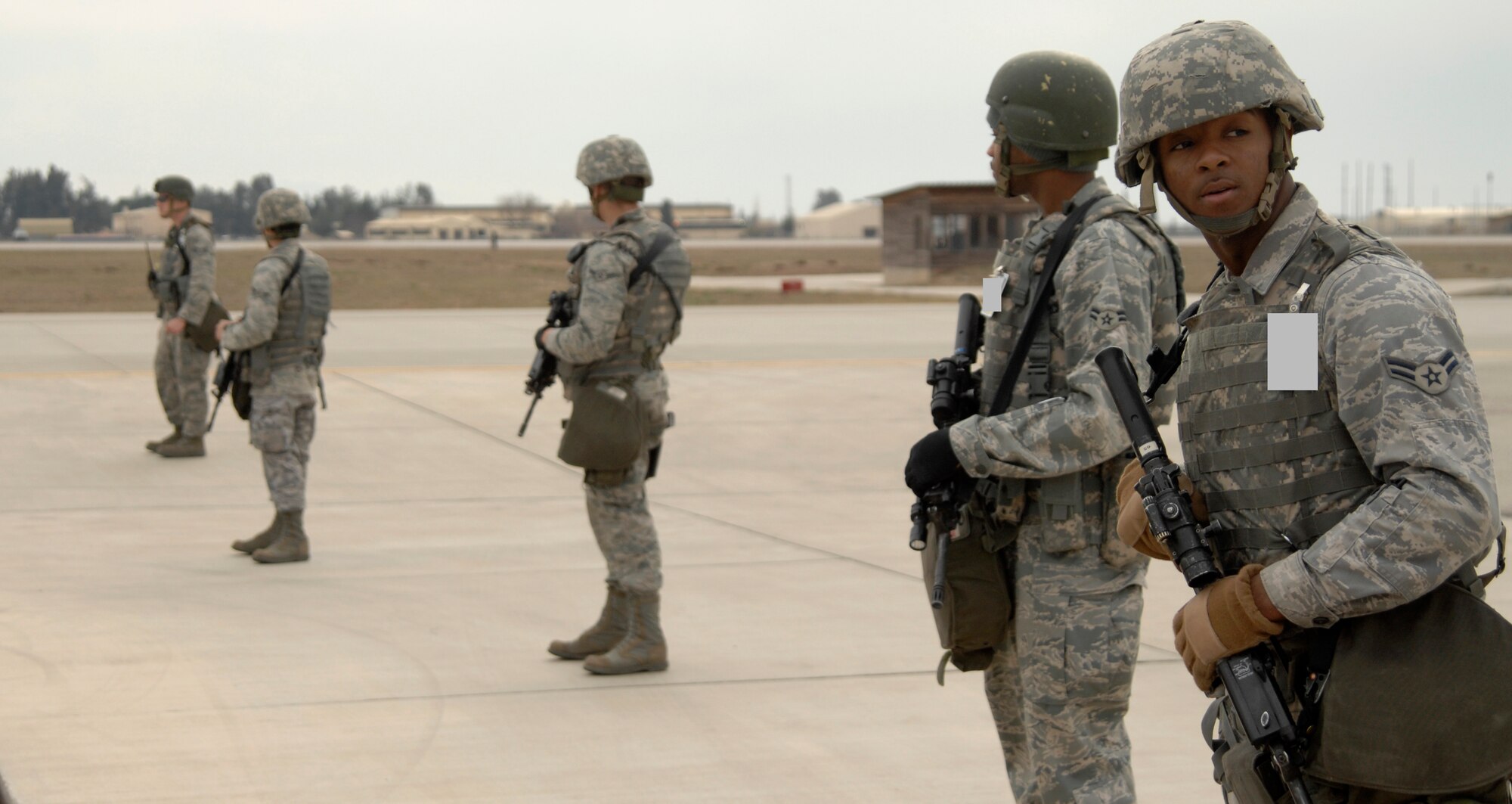 39th Security Forces Airmen sweep the flight line for potential hazards and unauthorized personnel before establishing a secure perimeter during an exercise, Jan. 16. Exercises are held monthly at Incirlik to maintain combat readiness. (U.S. Air Force photo/Senior Airman Benjamin Wilson)