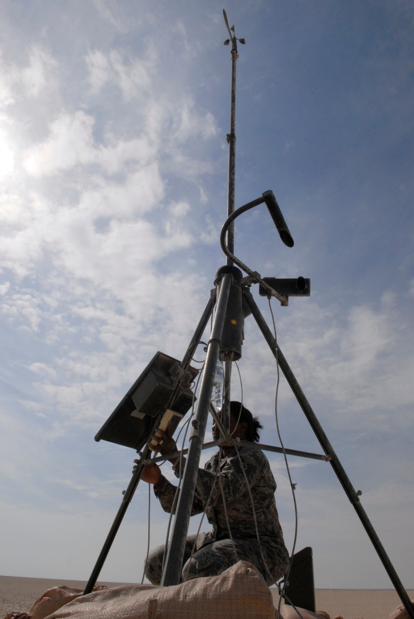 Technical Sergeant Nysheema Lett, a 379th Expeditionary Operations Support Squadron Weather Forecaster, inspects the Weather Flight's Tactical Meteorological System for damage and wear, Jan. 20, 2009, at an undisclosed location in Southwest Asia.  The system is on stand-by in case the primary meteorological tools shut down.  The information provided from the tools and weather observations provide the aviators and the base with vital information for aviation planning and safety of all personnel.  Tech. Sgt. Lett hails from Philadelphia, Pa. and is deployed from Sembach Air Base, Germany in support of Operation Iraqi and Enduring Freedom and Joint Task Force- Horn of Africa.  (U.S. Air Force Photo by Airman 1st Class Andrew Satran/Released)