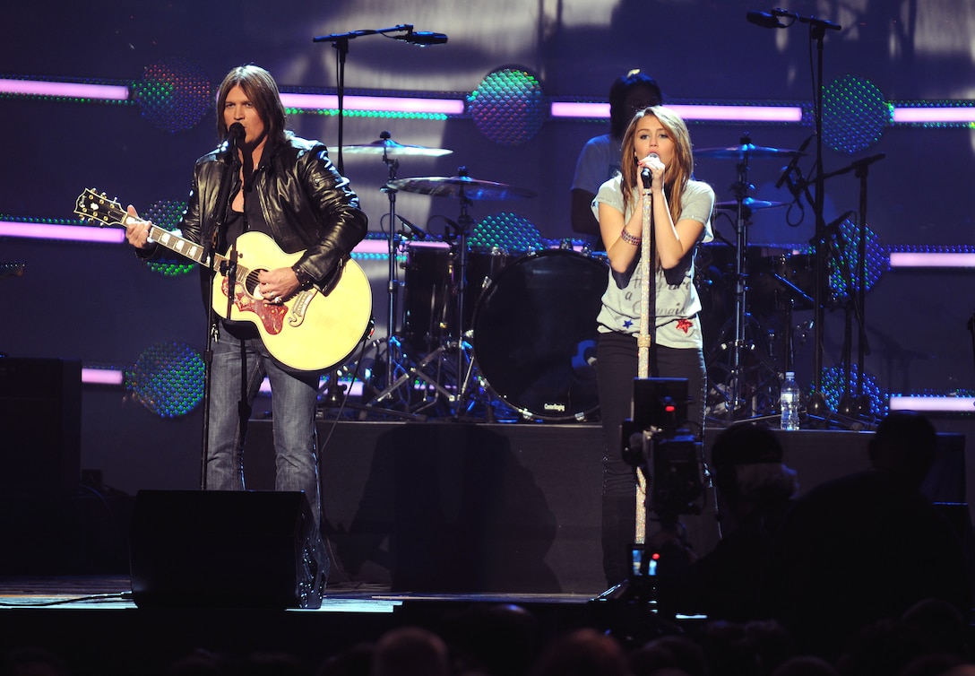 Billy Ray Cyrus and his daughter Miley Cyrus perform at the “Kids Inaugural: We Are the Future” concert at the Verizon Center in downtown Washington, D.C., Jan. 19, 2009.