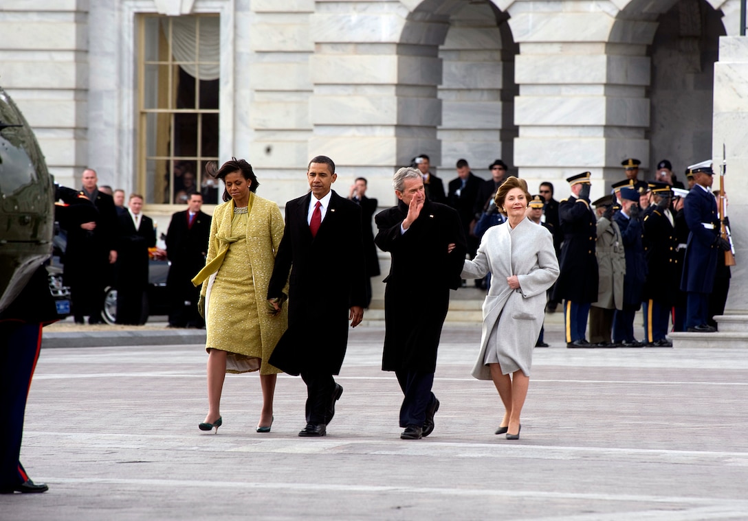 First Lady Michelle Obama and President Barack Obama escort former President George W. Bush and former first lady Laura Bush as the Bushes prepare to depart the Capitol Building at the conclusion of the 56th Presidential Inauguration, Washington, D.C., Jan. 20, 2009.