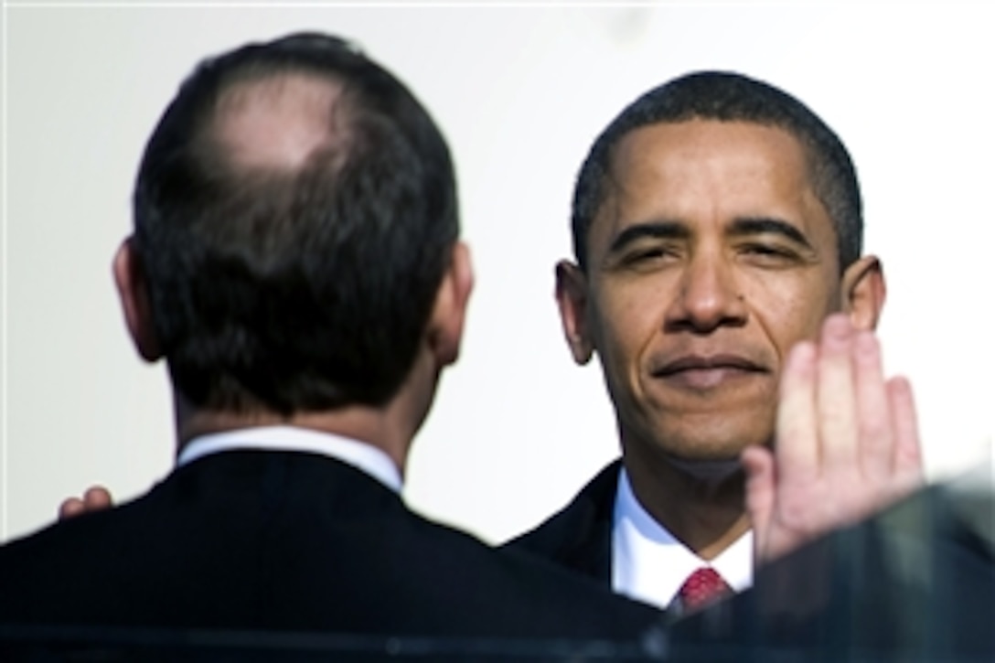 President Barack Obama takes the oath of office during the 56th Presidential Inauguration Ceremony, Washington, D.C., Jan. 20, 2009.