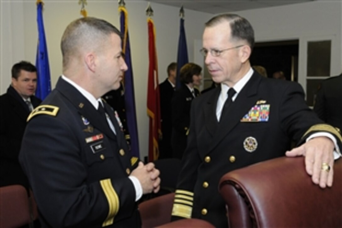 U.S. Army Maj. Gen. Richard J. Rowe, left, commander of troops for the presidential inauguration, speaks with U.S. Navy Adm. Mike Mullen, chairman of the Joint Chiefs of Staff, before an overview brief of inaugural events in Washington, D.C., Jan. 20, 2009. Rowe commands the Joint Force Headquarters National Capital Region, which stood up as a Joint Task Force during the inaugural period, and also heads the Armed Forces Inaugural Committee.