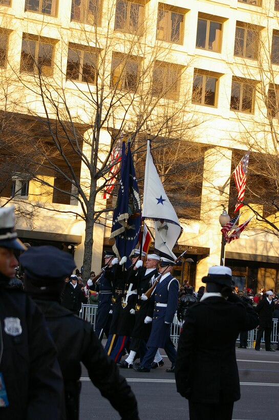 A joint color guard marches down Pennsylvania Ave. in the Inaugural Parade in Washington, Jan 20.