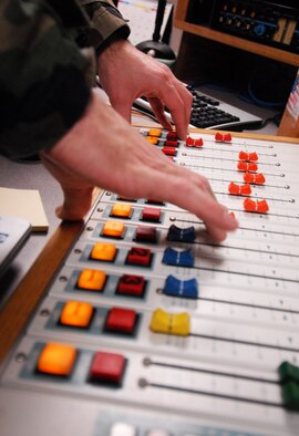 Staff Sgt. Aaron Drobnack, American Forces Network Kunsan, talks to the Wolf Pack on AFN The Eagle during the Peninsula-Wide Operational Readiness Exercise Beverly Bulldog 09-01 at Kunsan Air Base, Republic of Korea. AFN brodacasters normally host a morning radio show Monday through Friday, however when the base conducts an exercise the staff members broadcast 24 hours a day. (U.S. Air Force Photo by Senior Airman Gustavo Gonzalez)  