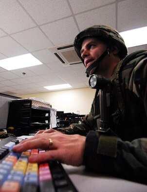 Staff Sgt. Michael Schocker, American Forces Network Kunsan, edits a news story during the Peninsula-Wide Operational Readiness Exercise Beverly Bulldog 09-01 at Kunsan Air Base, Republic of Korea. As an Air Force broadcaster Sergeant Schocker produces television and radio stories, and talks to the Kunsan community over the AFN radio network. (U.S. Air Force Photo by Senior Airman Gustavo Gonzalez)  