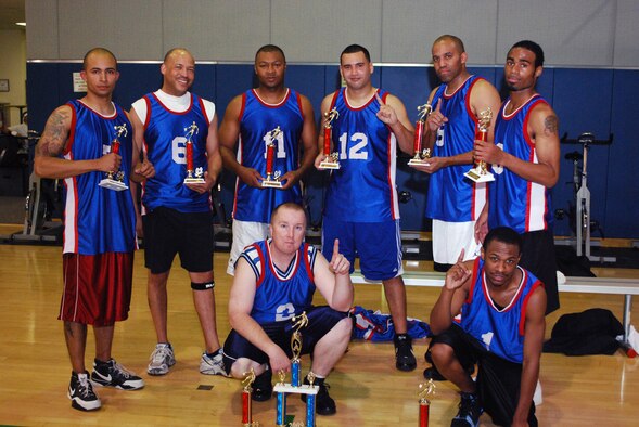 THE CHAMPS: The Navy team displays their championship trophies after the presentation in the Fitness Center, Jan. 7. The beat 452 SFS #1 in the championship game, 57 to 46. (U.S. Air Force photo)