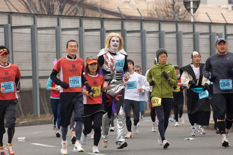 YOKOTA AIR BASE, Japan- A runner dressed as a Japanese punk rock star participates in the 28th Annual Frostbite Road Race here, Jan. 18. More than 8,500 runners participated, some of which chose to wear costumes which has become an established custom every year. The Frostbite run is one of Japan's Top 100 annual runs. (U.S. Air Force Photo / Osakabe Yasuo)
