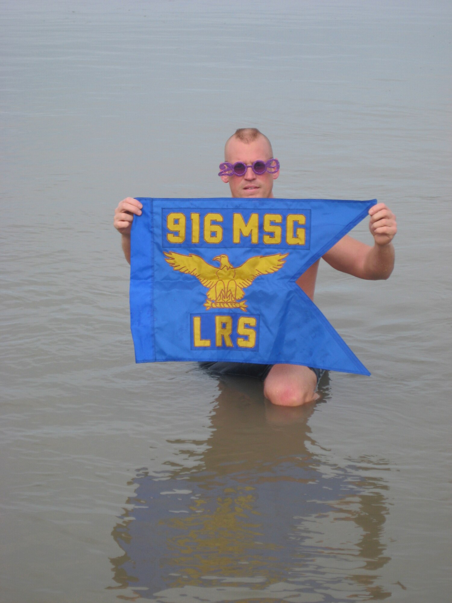SEYMOUR JOHNSON AIR FORCE BASE, N.C. -- With the cold temperatures and snow that have been affecting the Southeast this week, 916th Logistics Readiness Squadron First Sergeant Bob Ewest shows off his fortitude despite frigid temperatures. Sergeant Ewest, a 19-year member of the Polar Bear Club, gives a shout out to his squadron while taking a dip in Lake Erie in January.