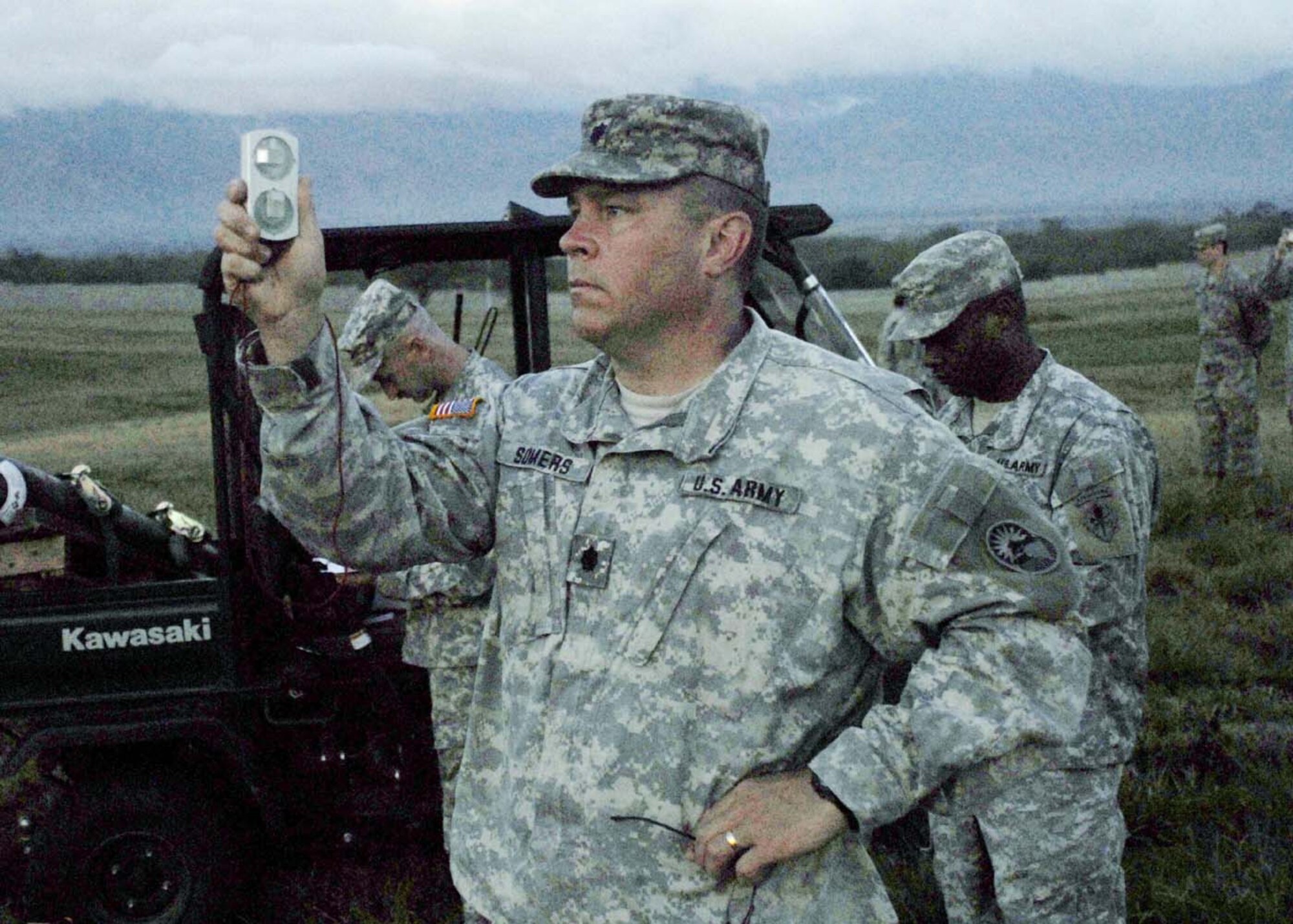 SOTO CANO AIR BASE, Honduras - U.S. Army Forces Commander Lt. Col. Richard Somers, takes a wind reading before the first jump of the day during combined airborne operations training here Jan. 15.  U.S. and Honduran Army forces train together to learn from each other and to build cohesion between the units.  (US Air Force photo/Tech Sgt. Rebecca Danét)