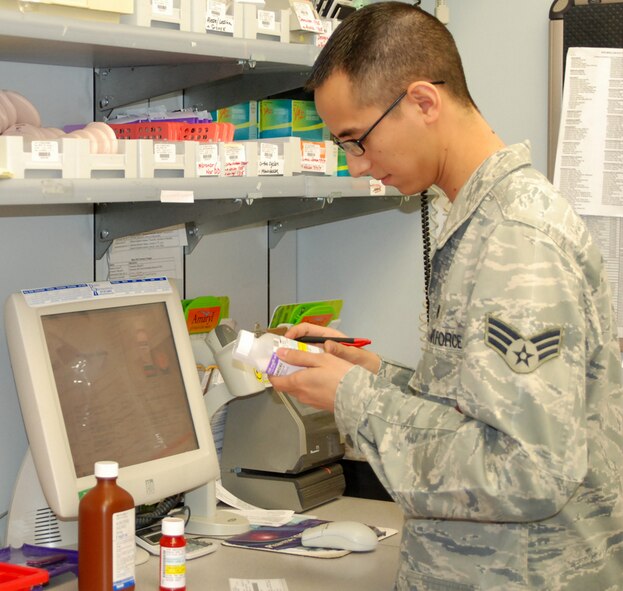 Senior Airman Andrew Banales, a 9th Medical Support Squadron pharmacy technician checks a prescription before packaging it Jan. 21 at the base pharmacy. Beale's pharmacy fills over 400 prescriptions each day. (Photo by Airman 1st Class Chuck Broadway)