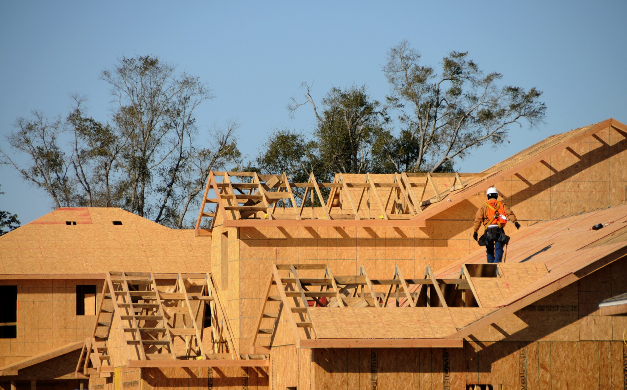 A construction worker surveys roofing progress in homes under construction in the south part of West Falcon Park.  The first homes in this area should be completed in March.  (U.S. Air Force photo by Kemberly Groue)