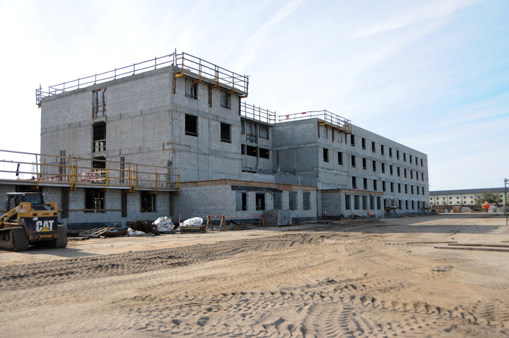 The ninth and final new student dormitory is taking shape in the Triangle.  Construction of the $31.3 million structure began a year ago and should be finished in February 2010.  (U.S. Air Force photo by Kemberly Groue)
