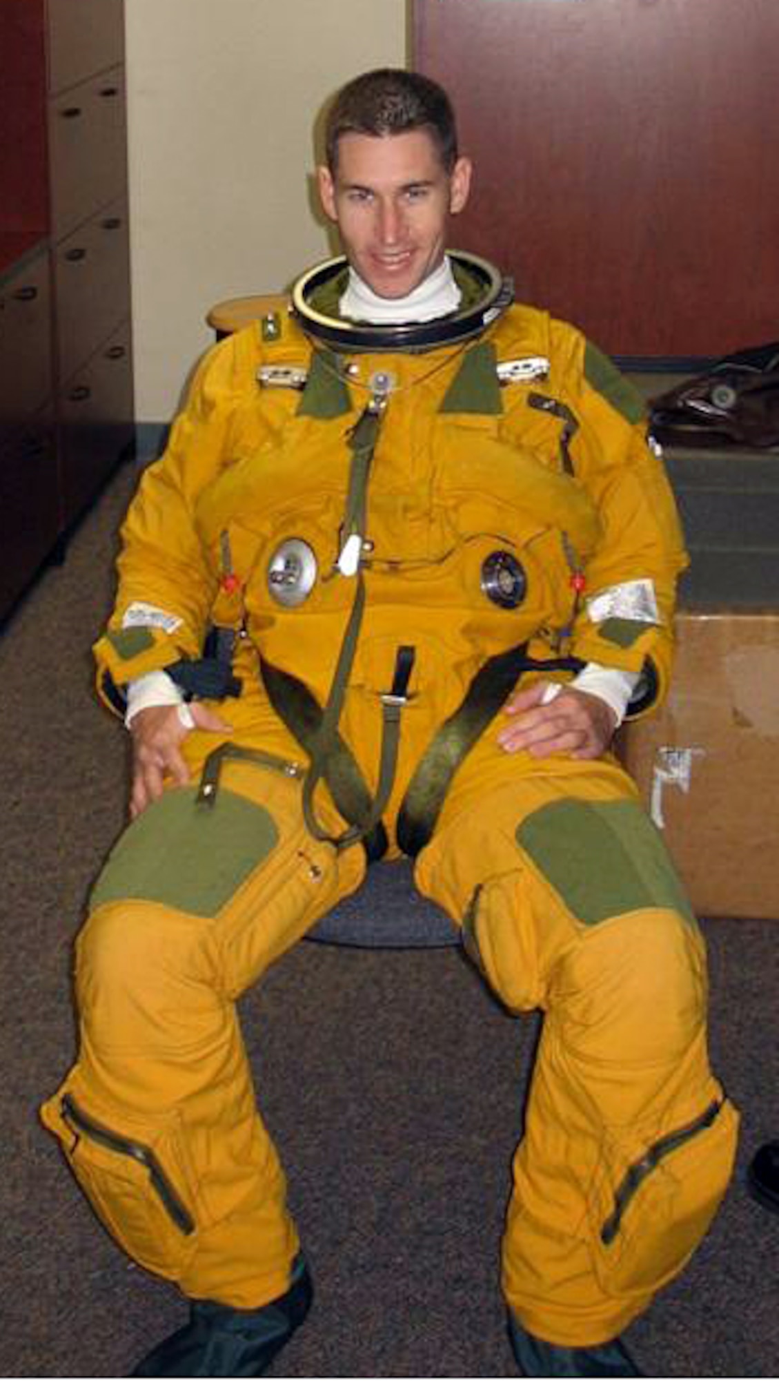 Capt. Brian Strack, an instructor pilot with the 32nd Flying Training Squadron at Vance, tries on the flight suit worn by U-2 high-altitude reconnaissance pilots when he interviewed for a U-2 assignment at Beale AFB, Calif., in 2006. He was accepted, until a medical condition disqualified him from flying. Since deploying to Creech AFB, Nev., this year, he has set his sights on flying an Unmanned Aircraft System. (Courtesy photo)