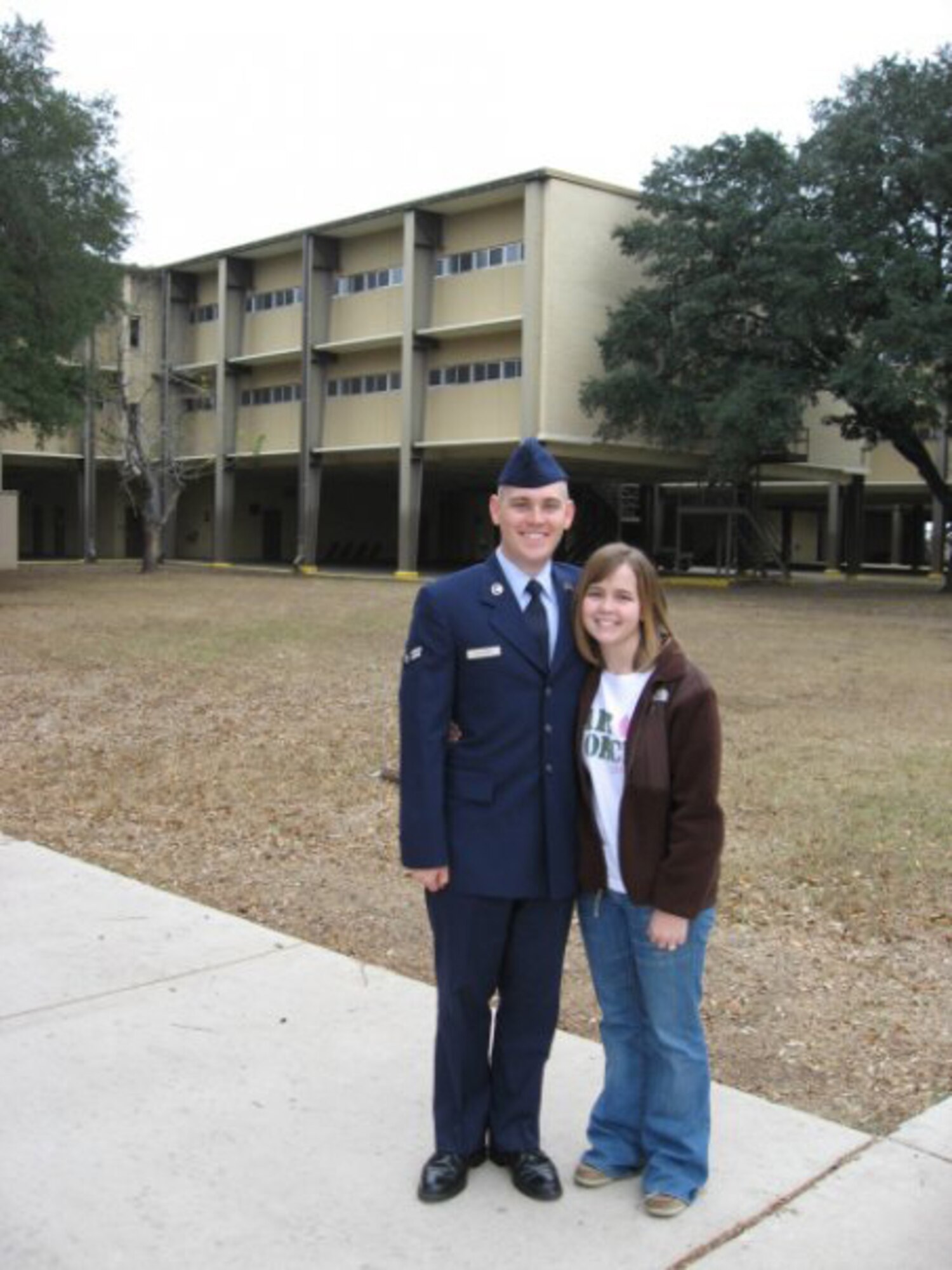 Airman Childers lost 70 pounds to enlist in the Air Force and is pictured at his graduation  with his wife, Ashley.  (Courtesy photo)