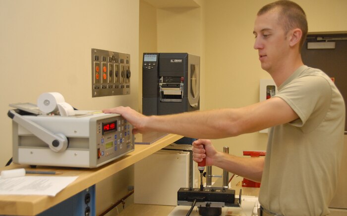 Airman 1st Class Ryan Yeager calibrates a torque screwdriver for Coast Guard Air Station Savannah, Ga., in the 437th Maintenance Squadron Precision Measurement Equipment Laboratory here Jan. 21. PMEL Airmen assess the capability of test equipment to make sure measurements are accurate and reliable in order for organizations base-wide to perform their operations with excellence. Airman Yeager is assigned to the 437 MXS as a test, measurement and diagnostic equipment apprentice. (U.S. Air Force photo/Airman Ian Hoachlander)