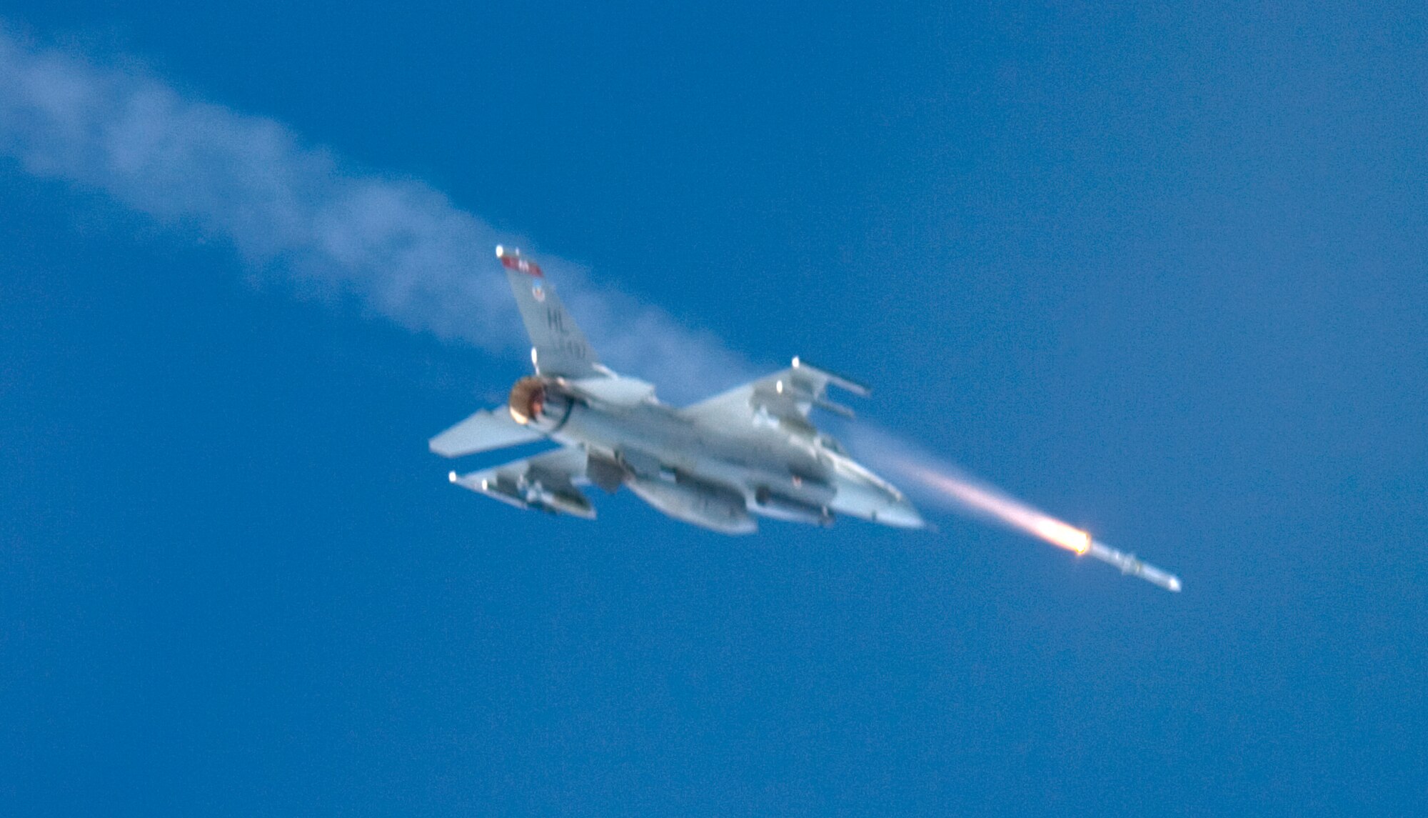 A F-16 Fighting Falcon from the 34th Fighter Squadron at Hill Air Force Base, Utah, fires a missile  at a airborne drone over the Gulf of Mexico Jan 14, during the Combat Archer portion of a mission.  The 34 FS participated in the first-ever combined Weapons System Evaluation Program.  This WSEP combined the live air-to-air missile firing of Combat Archer and the air-to-ground bomb drops of Combat Hammer into one continuous mission.  This major undertaking brought together the WSEP evaluators from the 83rd Fighter Weapons Squadron, located at Tyndall Air Force Base, Fla., and the 86th Fighter Weapons Squadron at Eglin.  This new combined mission began with the aircraft load and launch from Tyndall.  Then the pilot performed a live missile firing over the Gulf of Mexico.  After the missile launch, the pilot connected with a KC-135 Stratotanker from MacDill Air Force Base, Fla., for refueling.  Then, the pilot flew over the Eglin range to perform a live bomb drop.  (U.S. Air Force photo\Tech Sgt. Jason Wilkerson.)