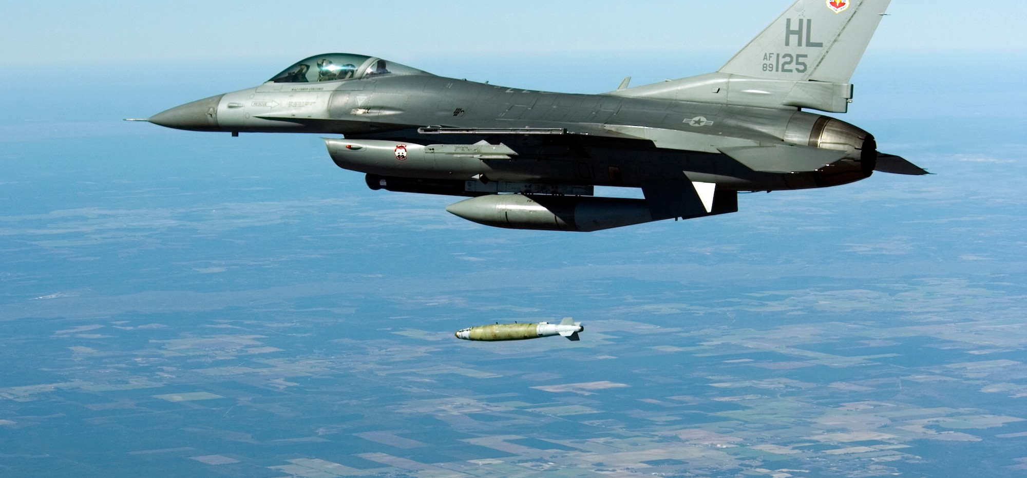 A F-16 Fighting Falcon from the 34th Fighter Squadron at Hill Air Force Base, Utah, drops a bomb during the Combat Hammer portion of a mission, Jan 14 over the Eglin Air Force Base range in Florida.  The 34 FS participated in the first-ever combined Weapons System Evaluation Program.  This WSEP combined the live air-to-air missile firing of Combat Archer and the air-to-ground bomb drops of Combat Hammer into one continuous mission.  This major undertaking brought together the WSEP evaluators from the 83rd Fighter Weapons Squadron, located at Tyndall Air Force Base, Fla., and the 86th Fighter Weapons Squadron at Eglin.  This new combined mission began with the aircraft load and launch from Tyndall.  Then the pilot performed a live missile firing over the Gulf of Mexico.  After the missile launch, the pilot connected with a KC-135 Stratotanker from MacDill Air Force Base, Fla., for refueling.  Then, the pilot flew over the Eglin range to perform a live bomb drop.  (U.S. Air Force photo\Tech Sgt. Jason Wilkerson.)