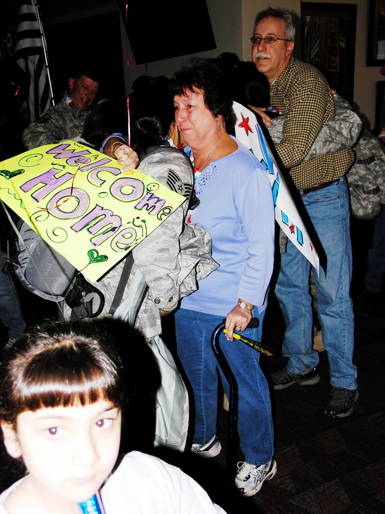 Sue Haskins, self-proclaimed mother of all 302nd Aeromedical Staging Squadron members waits to greet members returning from a four-month tour of duty at Balad Air Base, Iraq.  (U.S. Air Force photo/Tech. Sgt. David D. Morton)