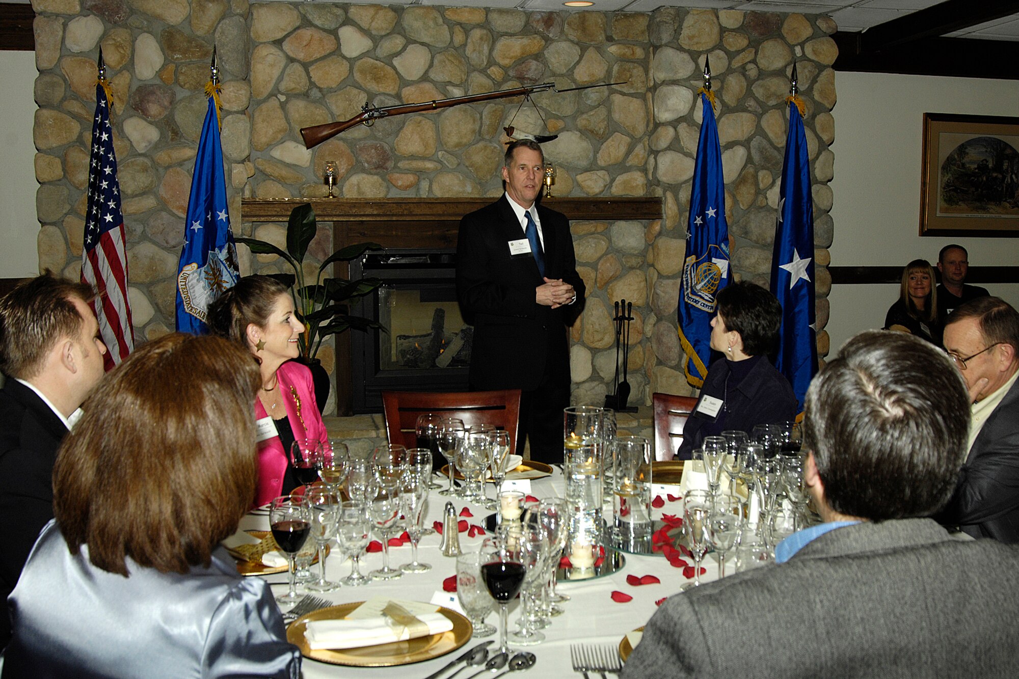 Electronic Systems Center Commander Lt. Gen. Ted Bowlds welcomes guests to an evening of gourmet dining, held at the Minuteman Club Jan. 16. The meal, featuring five courses paired with an appropriate wine, was prepared by Senior Master Sgt. Mark Veomett, enlisted aide to the ESC commander, and members of the club staff.  (U.S. Air Force photo by Linda LaBonte Britt)