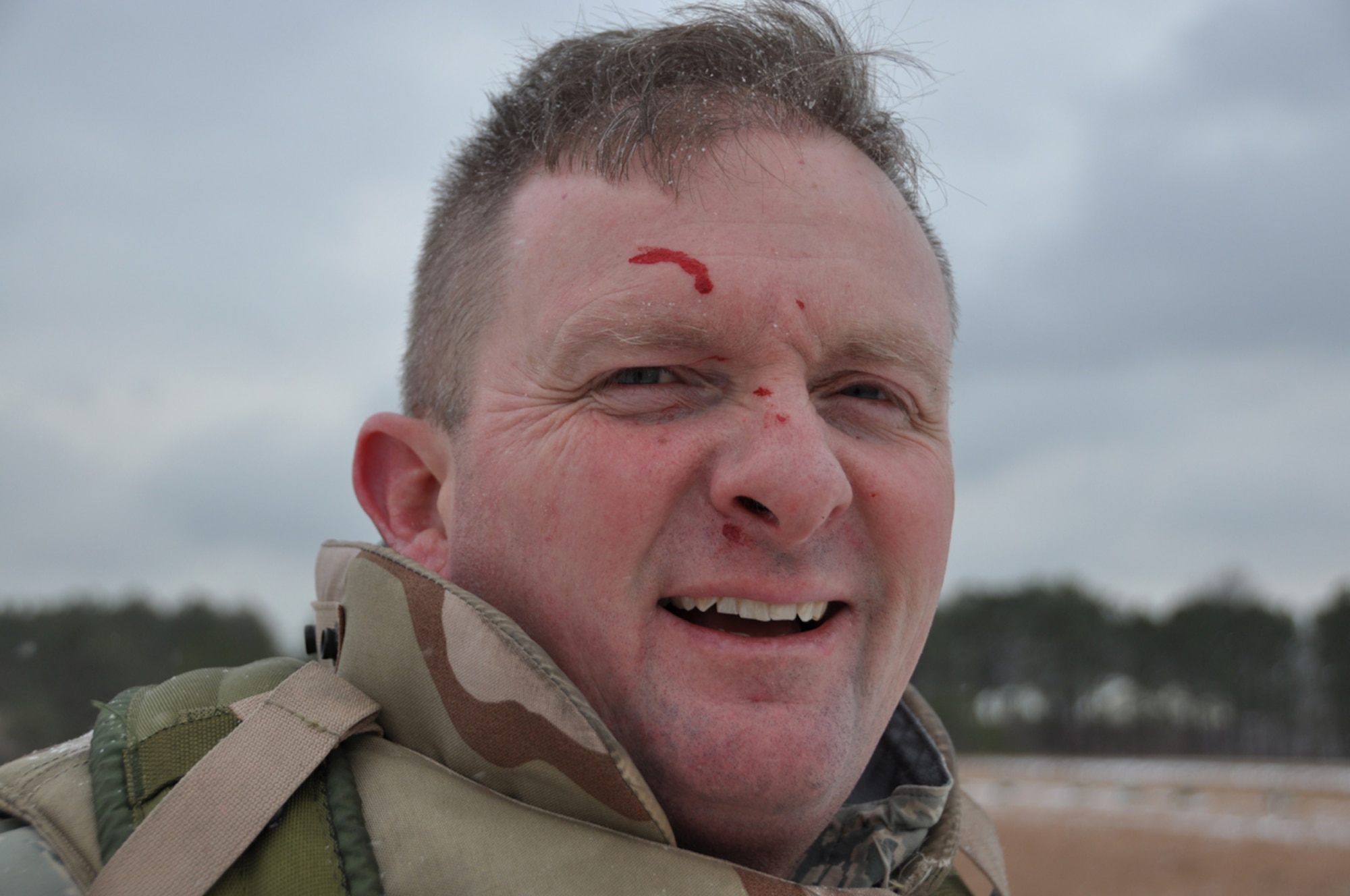 Chief Master Sgt. James Dowell, 621st Contingency Response Wing command chief, proudly displays the "battle wounds" he sustained during the combatives training portion of the Defensive Operations Course held here Jan 12-15. As most physical fights last a relatively short amount of time, the combatives training pitted Airmen against each other in two, three-minute rounds where they used various hand-to-hand combat techniques in attempts to maintain physical control of their adversary. (U.S. Air Force photo/1Lt Dustin Doyle)