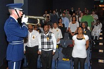 MINOT, N.D. – 1st Lt. Philip Blong, a member of the Minot Air Force Base Honor Guard, plays taps following a moment of silence during the sixth annual celebration of Martin Luther King Jr.'s life achievements at Minot State University’s Aleshire Theater here Jan. 19. 2009 was a year that brought progress and a renewed emphasis on safe, secure and reliable nuclear operations. The 91st Missile Wing transitioned to Air Force Global Strike Command with the 5th Bomb Wing scheduled to follow suit in 2010. (U.S. Air Force photo by Senior Airman Kelly Timney)