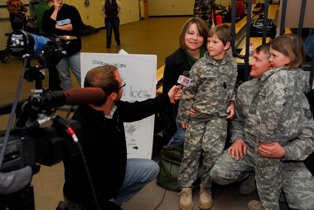 Family members and local media welcome home U.S. Air Force Tech. Sgt. Nolan Voss, 148th Fighter Wing, in Duluth, Minn. January 20, 2009.  Approxematly 60 Air National Guardsmen returned home from their recent Air Expeditionary Force deployment to Joint Base Balad, Iraq.