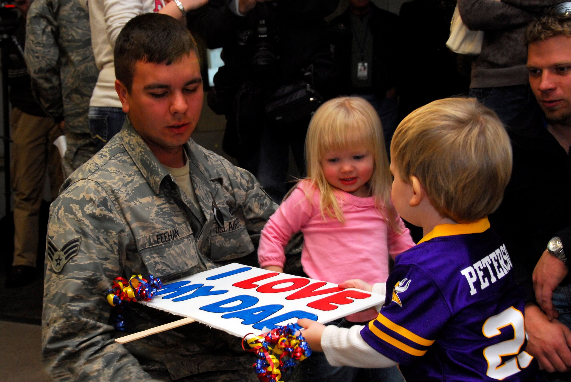 Family members welcome home U.S. Air Force Senior Airman Noah Feehan, 148th Fighter Wing, in Duluth, Minn. January 20, 2009.  Approxematly 60 Air National Guardsmen returned home from their recent Air Expeditionary Force deployment to Joint Base Balad, Iraq.