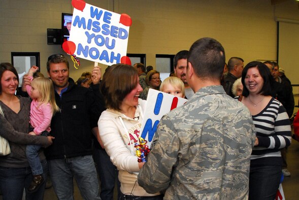 Family members welcome home U.S. Air Force Senior Airman Noah Feehan, 148th Fighter Wing, in Duluth, Minn. January 20, 2009.  Approxematly 60 Air National Guardsmen returned home from their recent Air Expeditionary Force deployment to Joint Base Balad, Iraq.