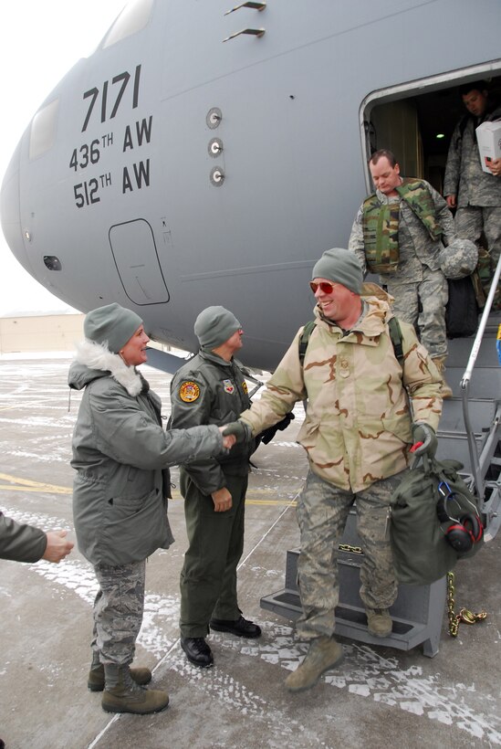 148th Fighter Wing Command Chief Master Sgt. Jodi Stauber and Commander Col. Mark Johnson greet returning members of the unit in Duluth, Minn. January 20, 2009.  Approxematly 60 Air National Guardsmen returned home from their recent Air Expeditionary Force deployment to Joint Base Balad, Iraq.