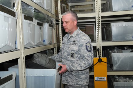 Master Sgt. George Barkman inspects gear given to all deploying security forces personnel. Sergeant Barkman received an Air Force level award that cited his leadership and organizational qualities. (U.S. Air Force photo by Rich McFadden)