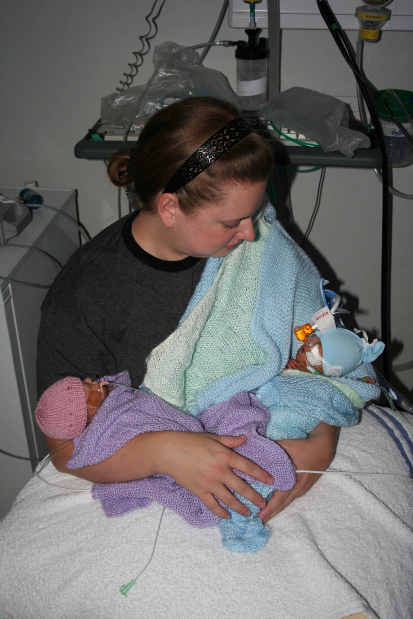 Mandy Frazier, wife of Tech. Sgt. Barry Frazier, 100th Air Refueling Wing Legal Office, holds her premature twins at the neonatal intensive care unit at Norfolk and Norwich Hospital, in November. The twins were born almost four months prematurely, Sept. 6. Her daughter Alexis, left, weighed just 1 pound, 3 ounces, and her brother, Eric, right, weighed 1 pound, 5 ounces. Sadly, Eric died Dec. 10 after suffering serious health problems. (Courtesy photo)