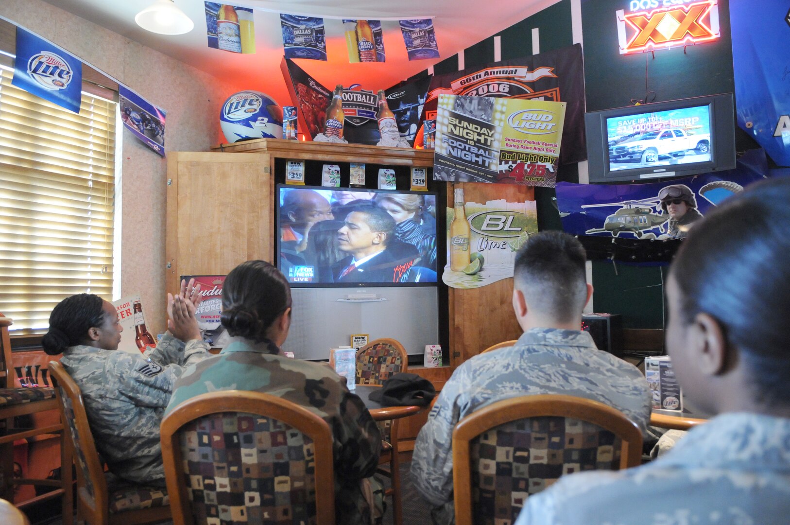 Team Randolph Airmen watch as Barack Obama is sworn in as the 44th president of the United States during the 2009 Inauguration Mixer at the enlisted club Jan. 20. (Photo by Rich McFadden)