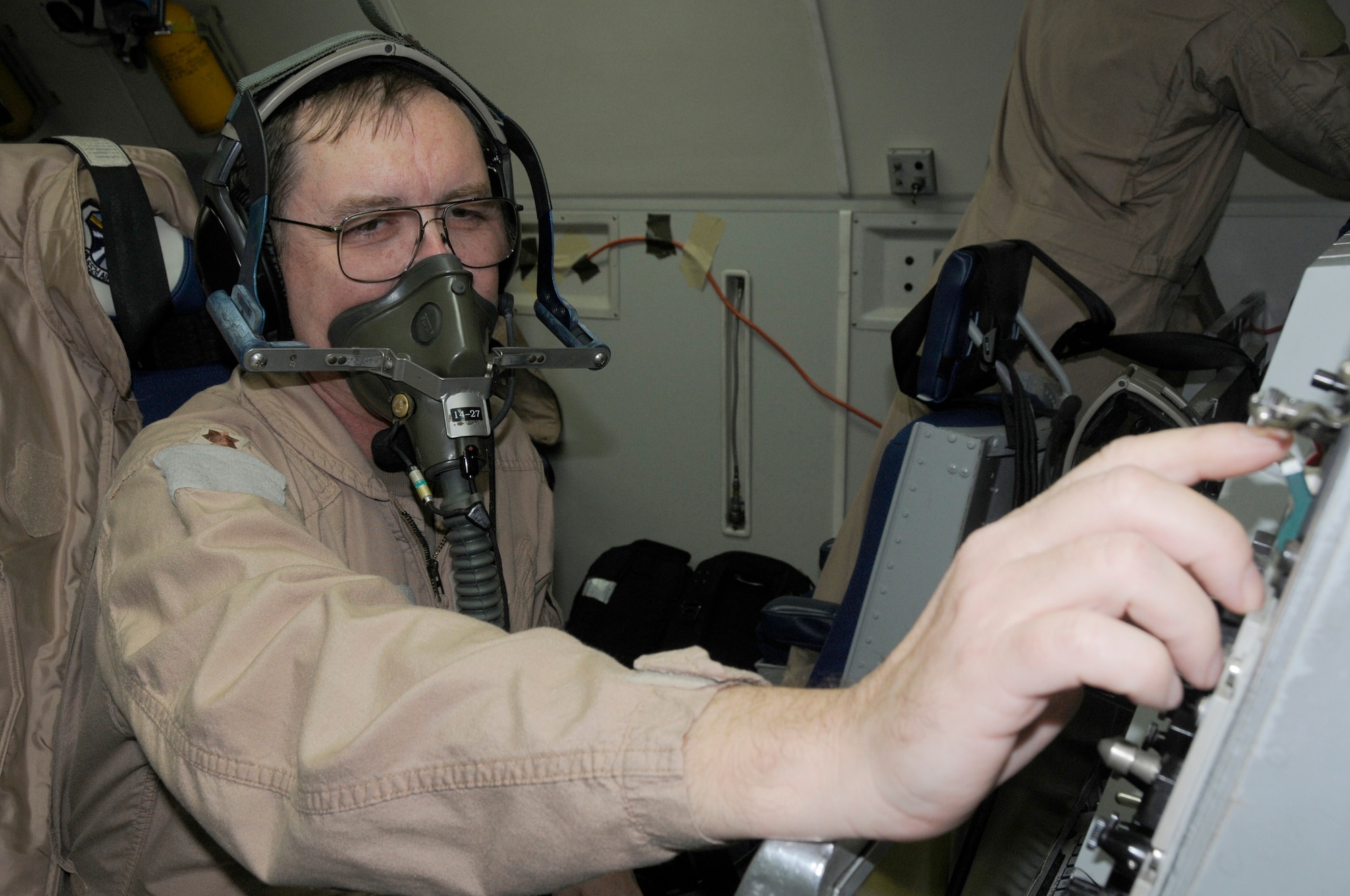 Maj. Jon Williams, 963rd Expeditionary Airborne Air Control Squadron, mission crew commander, adjusts his oxygen level during pre-flight checks, Jan. 15. Major Williams reached a milestone of flying hours as an air battle manager on an E-3 Sentry with a year's worth of hours (8,760 hours). Major Williams is from Edmond, Okla. and his home station is Tinker Air Force Base, Okla. (U.S. Air Force photo by Senior Airman Brian J. Ellis)