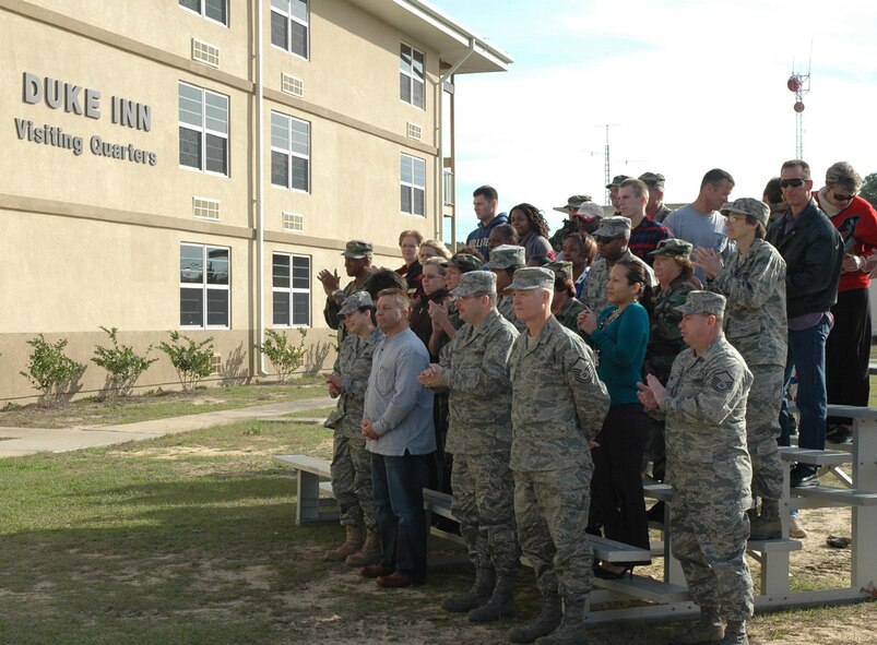 Members of the 919th Special Operations Wing applaud during Thursday's grand re-opening ceremony for the Duke Inn Visiting Quarters. The three-story lodging facility officially re-opened Thursday after an 18-month, $5.6 million renovation project brought state-of-the-art amenities to a facility that for years failed to meet Air Force lodging standards.  The renovation, funded by Air Force Reserve Command, features 48 private rooms with full baths, queen-size beds, two handicapped-accessible rooms, a guest elevator and a lobby business center with computer access, a beverage bar and numerous other amenities. (U.S. Air Force Photo by Daniel Neely)
