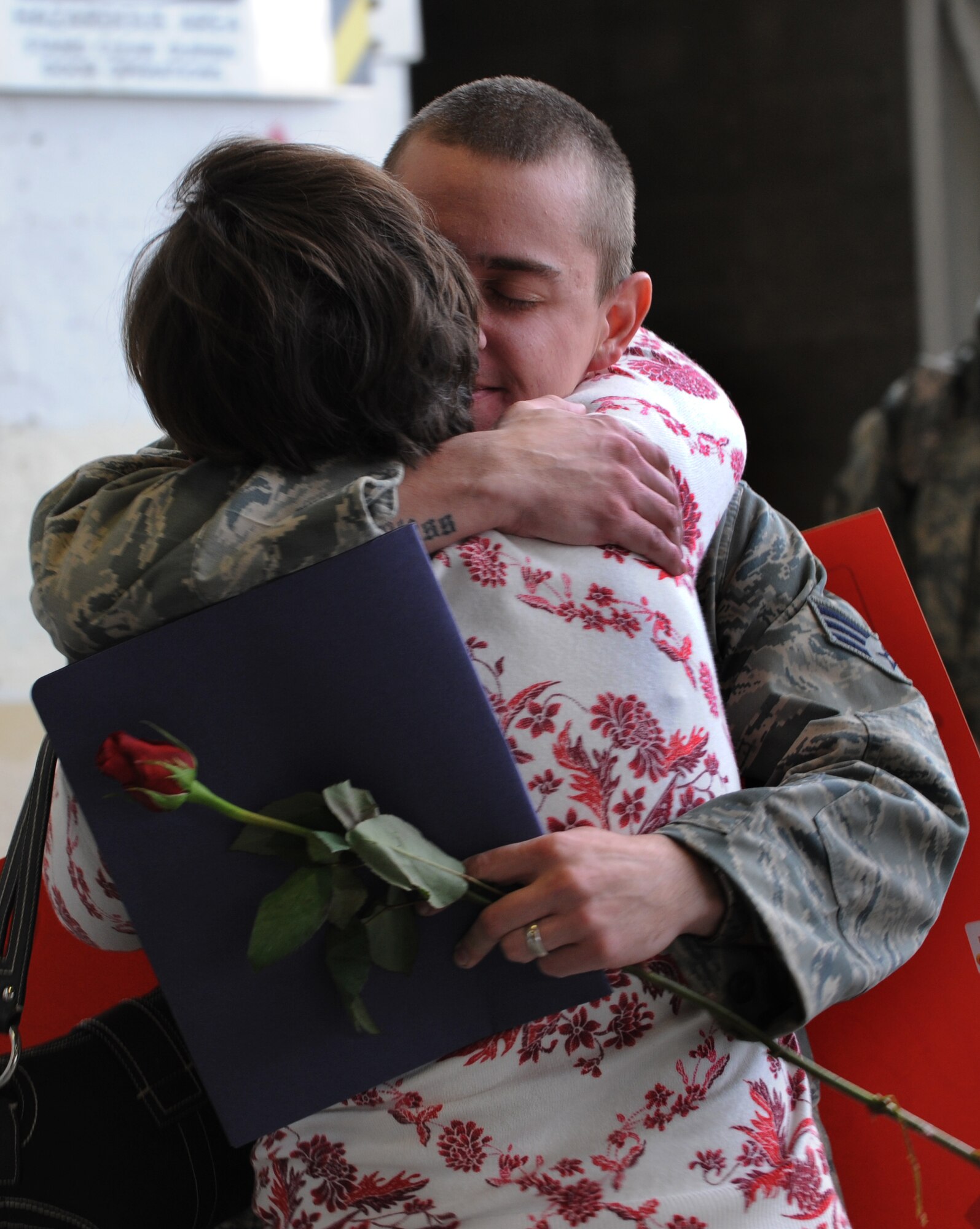 MOUNTAIN HOME AIR FORCE BASE, Idaho -- Senior Airman Chase Hecathorn, 726th Air Control Squadron, hugs his mother upon his return from Iraq on Jan. 17. More than 170 members of the 726th Air Control Squadron returned to Mountain Home on Jan. 17 following nearly five months of combat duty in Iraq. In addition, 12 F-15E Strike Eagles along with aircrews and maintenance teams with the 391st Fighter Squadron also returned here Jan. 17 following a four-month deployment to Bagram Air Base, Afghanistan.  (U.S. Air Force photo/Airman 1st Class Renishia R. Richardson)