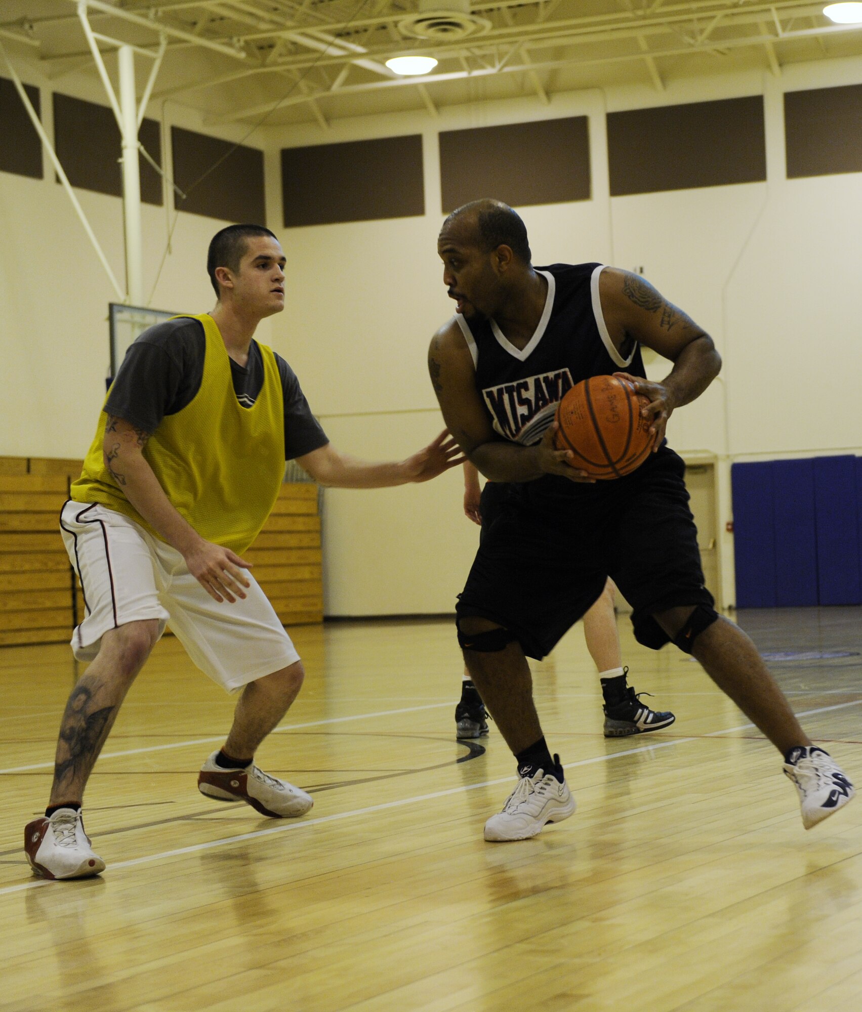 MOUNTAIN HOME AIR FORCE BASE, Idaho -- Mark Fox, 366th Security Forces Squadron team, prepares to dribble around a defender during a Jan. 12 intramural basketball game between 366th SFS and 726th Air Control Squadron. The 366th SFS won 49-39. Games are played Monday through Thursday at 5, 6 and 7 p.m. with the last game played March 4. (U.S. Air Force photo/Airman 1st Class Renishia Richardson)