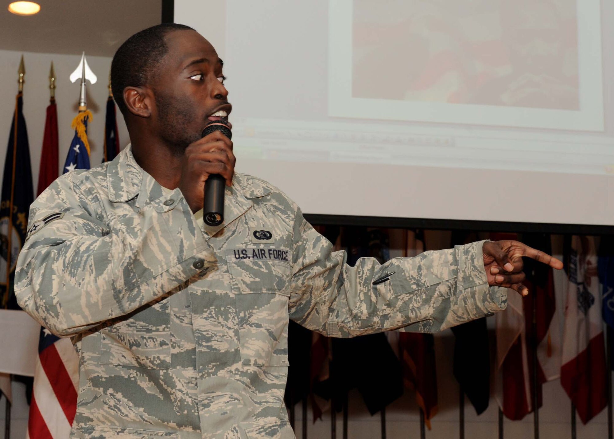 DYESS AIR FORCE BASE, Texas -- Airman 1st Class Dowayne Colquitt, from the 7th Communications Squadron, raps his poetry during the Dr. Martin Luther King, Jr. luncheon here, Jan. 16. The event was held to honor the legacy of Dr. King and his dream. (U.S. Air Force photo by Airman 1st Class Stephen Reyes)

